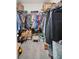 Spacious walk-in closet with shelving, shoe racks and room for hanging clothes at 7774 Sail Clover Ln, Zephyrhills, FL 33540