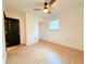 Empty bedroom with a ceiling fan and natural light offering potential for customization at 7908 Croton Ave, Tampa, FL 33619
