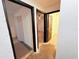 Hallway shows multiple doorways leading to bedrooms, showcasing the home's layout at 7908 Croton Ave, Tampa, FL 33619