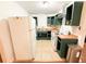 Kitchen features a refrigerator, cabinets, countertops, sink, microwave, and oven at 7908 Croton Ave, Tampa, FL 33619