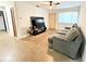 The living room includes a sofa, television, ceiling fan, and a window at 7908 Croton Ave, Tampa, FL 33619