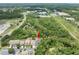 Aerial view of a home nestled among lush trees and close to nearby amenities at 8050 Diablo Ct, Trinity, FL 34655