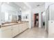 Large bathroom featuring double sinks, ample counter space, and a separate shower area at 8050 Diablo Ct, Trinity, FL 34655
