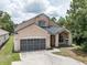Charming two-story home featuring a spacious two-car garage and inviting front porch at 8050 Diablo Ct, Trinity, FL 34655