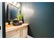 Stylish half bathroom featuring a vessel sink, modern faucet, and wood countertop at 8050 Diablo Ct, Trinity, FL 34655