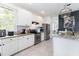 Modern kitchen with stainless steel appliances, granite countertops and ample cabinet space at 8050 Diablo Ct, Trinity, FL 34655