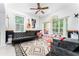 Spacious living room featuring ample natural light, modern decor, and neutral finishes at 8050 Diablo Ct, Trinity, FL 34655