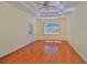 Bedroom with hardwood floors, trey ceilings, large window, and access to the back yard at 8213 Swann Hollow Dr, Tampa, FL 33647