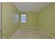 Carpeted bedroom featuring window, providing a comfortable living space at 8213 Swann Hollow Dr, Tampa, FL 33647