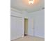 Carpeted bedroom with natural light, closet and doorway, providing a comfortable and private space at 8213 Swann Hollow Dr, Tampa, FL 33647