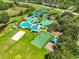 Community pool and recreational area with volleyball, basketball, playset and tennis courts at 8213 Swann Hollow Dr, Tampa, FL 33647