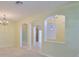 Bright dining room featuring decorative archways, tile floors, and an ornate chandelier at 8213 Swann Hollow Dr, Tampa, FL 33647