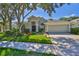 Lovely single-story home featuring well-maintained landscaping, mature trees, and a welcoming two-car garage at 8213 Swann Hollow Dr, Tampa, FL 33647