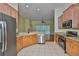 Eat-in kitchen features granite countertops, stainless appliances, and bar-height seating at 8213 Swann Hollow Dr, Tampa, FL 33647