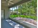 Screened in porch with a ceiling fan and a view of the backyard and fence at 8213 Swann Hollow Dr, Tampa, FL 33647