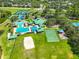 Tennis and pickle ball courts with pool, clubhouse, pond, and playground nearby at 8213 Swann Hollow Dr, Tampa, FL 33647