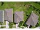 An aerial view of houses, roofs, backyards, and street in a residential neighborhood at 8515 Hunters Fork Loop, Ruskin, FL 33573