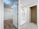 Bathroom featuring a bright white shower and tile floors with a walk-in closet in view at 8515 Hunters Fork Loop, Ruskin, FL 33573