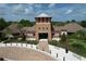 A beautiful clubhouse featuring brick and stone construction with lush landscaping at 8515 Hunters Fork Loop, Ruskin, FL 33573