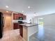 Modern kitchen featuring a center island, black appliances, and plenty of counter space at 8515 Hunters Fork Loop, Ruskin, FL 33573