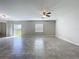 Spacious living room with sliding glass doors to the outdoors, showcasing the bright interior at 8515 Hunters Fork Loop, Ruskin, FL 33573