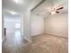 Bright living room featuring tile flooring and a ceiling fan for added comfort at 8515 Hunters Fork Loop, Ruskin, FL 33573
