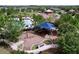 Aerial view of community playground with swings and a covered play structure for children at 8515 Hunters Fork Loop, Ruskin, FL 33573
