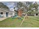 Backyard featuring a playset at 8701 N Packwood Ave, Tampa, FL 33604