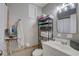 This is a cozy bathroom with neutral tones and a sink vanity at 8701 N Packwood Ave, Tampa, FL 33604