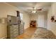 Bright bedroom with wood-look floors and a ceiling fan for comfort at 8701 N Packwood Ave, Tampa, FL 33604
