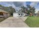 Single-story home with a well-kept lawn and a play set at 8701 N Packwood Ave, Tampa, FL 33604