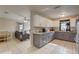 Modern kitchen with granite counters, two-tone cabinets, stainless appliances, and open to the living space at 8701 N Packwood Ave, Tampa, FL 33604