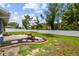 Backyard featuring a patio, a gravel walkway and a well-manicured lawn at 8823 Aruba Ln, Port Richey, FL 34668