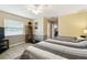 A lovely bedroom with a ceiling fan, neutral paint, tile flooring, and a window with blinds at 8823 Aruba Ln, Port Richey, FL 34668