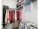 Organized walk-in closet featuring shelving and hanging storage and lots of storage at 8823 Aruba Ln, Port Richey, FL 34668