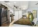 Bright kitchen features speckled granite counters, stainless steel appliances and decorative tile backsplash at 8823 Aruba Ln, Port Richey, FL 34668
