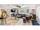 Spacious living room featuring modern furnishings, decorative lighting, and a large window at 8823 Aruba Ln, Port Richey, FL 34668