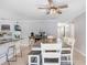 Open dining area with a large table, seating for six, and a ceiling fan at 901 Strawberry Ln, Brandon, FL 33511
