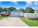 Detached two-car garage with a basketball hoop on the driveway, offering plenty of space for parking at 901 Strawberry Ln, Brandon, FL 33511