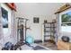Bright home gym featuring workout equipment, shelves, and decor creating an exercise space at 901 Strawberry Ln, Brandon, FL 33511