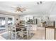 Open-concept kitchen and dining area featuring white cabinetry, stainless steel appliances and tile floors at 901 Strawberry Ln, Brandon, FL 33511