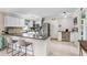 Kitchen features granite counters, bar seating, and stainless appliances at 901 Strawberry Ln, Brandon, FL 33511