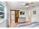 Bedroom featuring en suite bath with rustic sliding door and updated vanity at 901 Strawberry Ln, Brandon, FL 33511