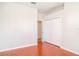 This bedroom features hardwood floors and a closet at 9067 39Th Street E Cir, Parrish, FL 34219