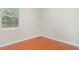 Minimal bedroom with wood floors, a window, and baseboards at 9067 39Th Street E Cir, Parrish, FL 34219