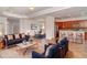 Open-concept living area featuring stylish furnishings and seamless flow to the dining area and modern kitchen at 9067 39Th Street E Cir, Parrish, FL 34219
