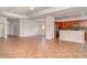 Expansive living area showcases tile floors, neutral walls, and an open layout connecting the kitchen and dining spaces at 9067 39Th Street E Cir, Parrish, FL 34219