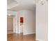 Bright open-concept living space featuring tile flooring, white walls, and adjacent laundry room access at 9067 39Th Street E Cir, Parrish, FL 34219