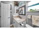 Nicely decorated bathroom with granite countertops, framed mirror and decorative fish accents at 11236 116Th St, Largo, FL 33778