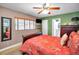Bedroom featuring a ceiling fan, window, and tropical-themed decor at 11236 116Th St, Largo, FL 33778